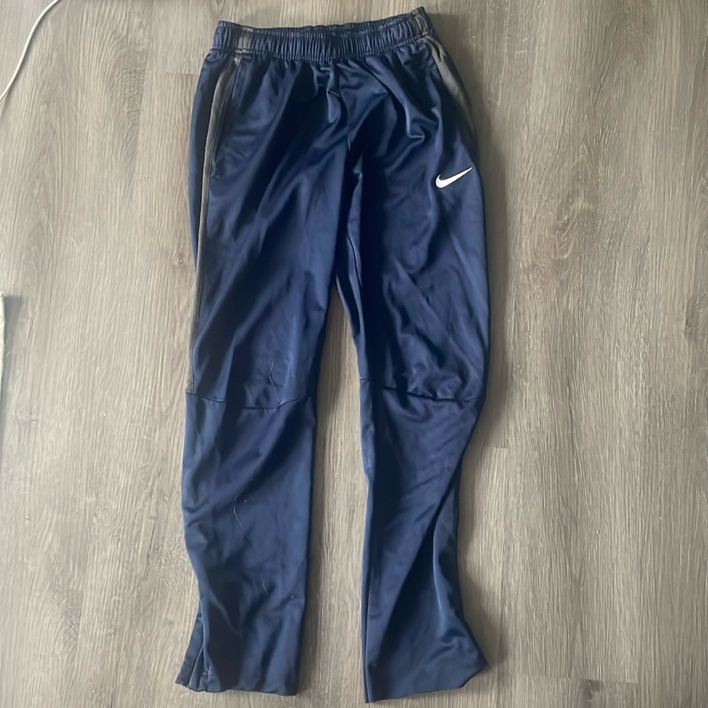 Nike. Navy blue pants w/ grey detailing